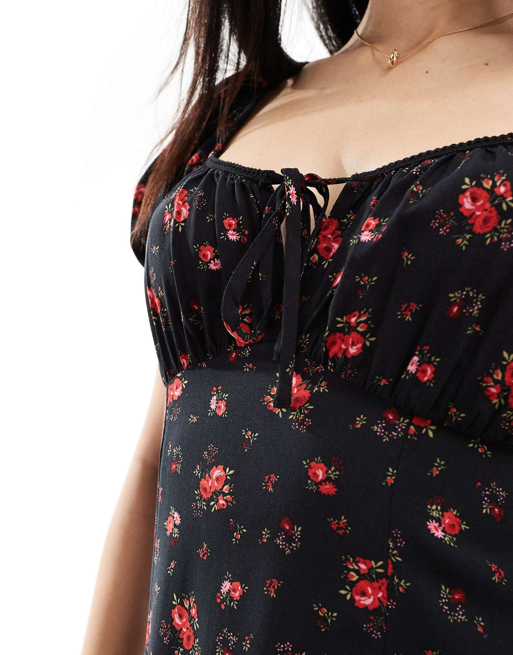 Black floral dress with red flowers on a white background. floral pattern dress