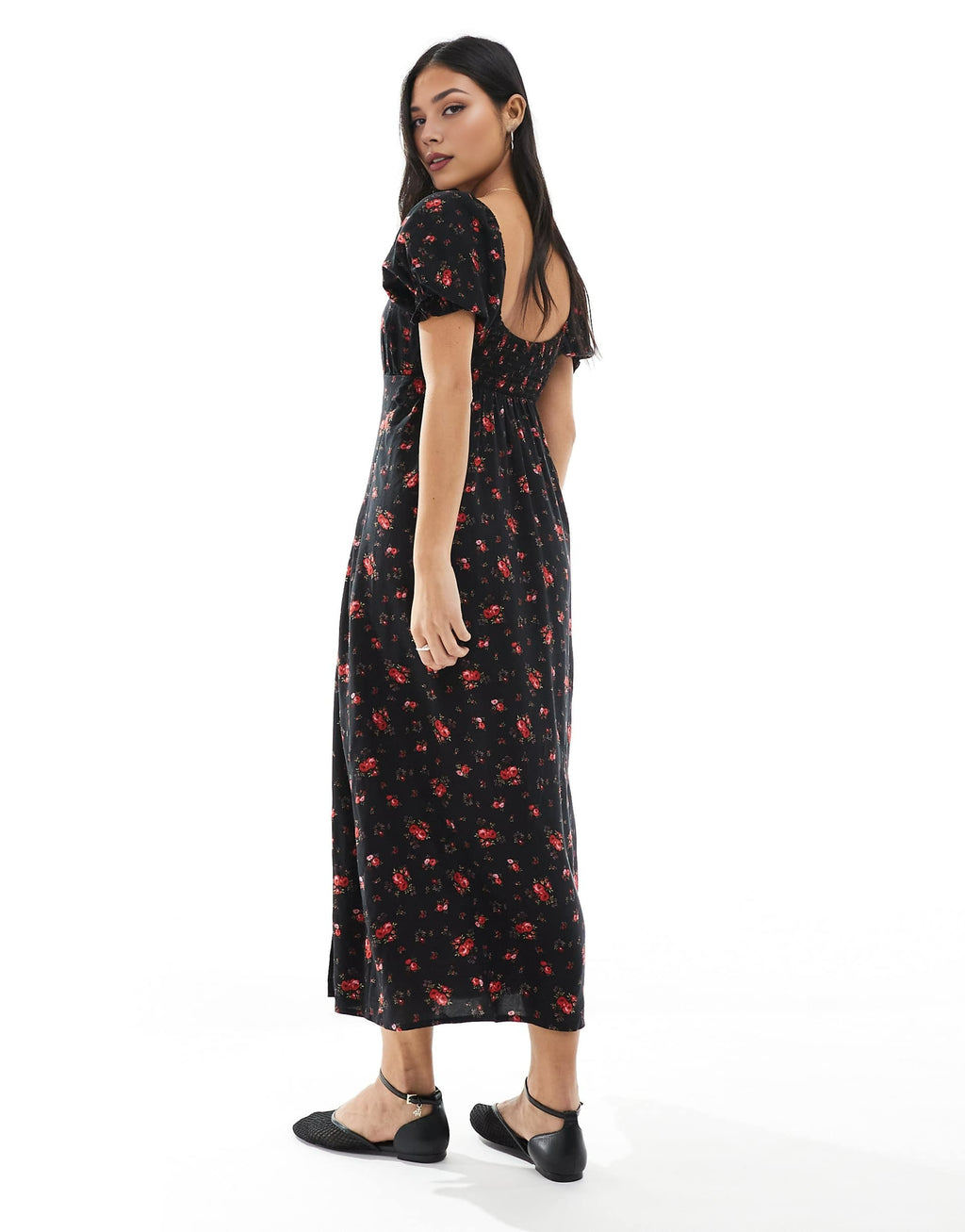 Woman wearing a black floral dress on a white background. summer dress, midi dress